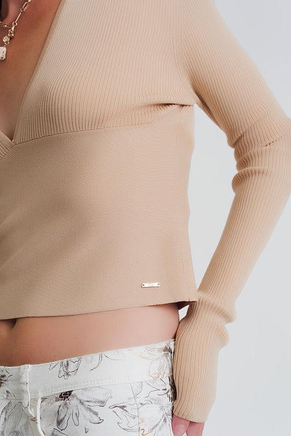 Sueter de canale en beige de cuello pico