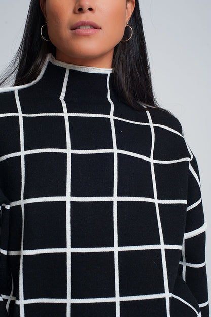 Suéter negro 3/4 con estampado de cuadros detalle en la manga y cuello alto