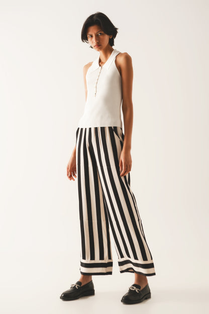 Top de punto canalé con cuello polo en crema
