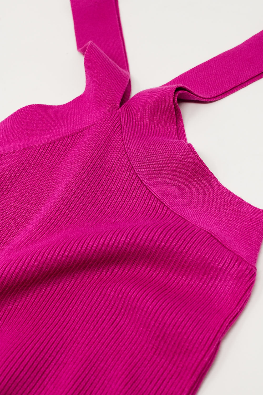 Top de punto cruzado en fucsia