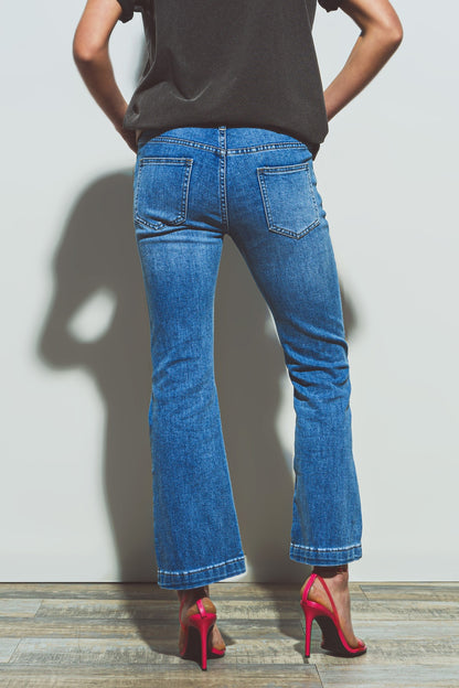 Vaqueros acampanados de cintura con doble botón en denim azul