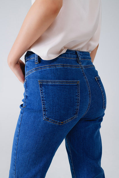 Vaqueros básicos azul oscuro con detalle de trenza en la cintura