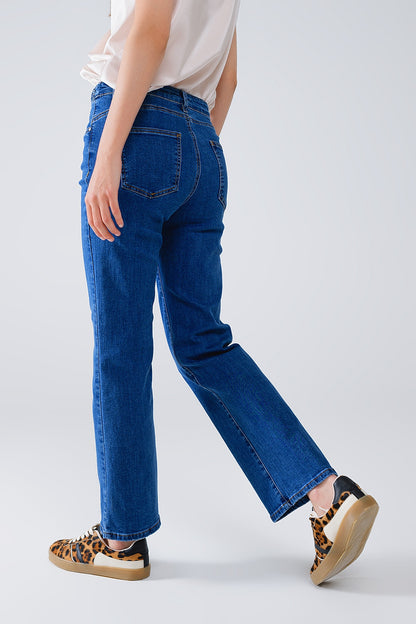 Vaqueros básicos azul oscuro con detalle de trenza en la cintura