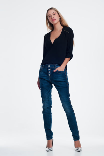 Vaqueros con tachuelas con tira lateral polipiel