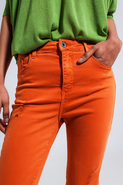 Vaqueros naranja de talle alto y corte pitillo