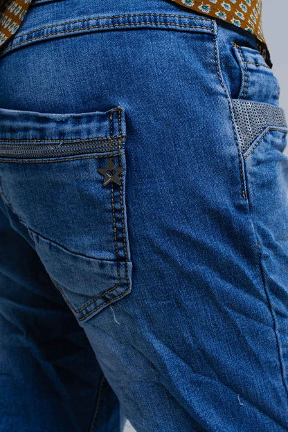 Vaqueros pitillo azules con detalles de lentejuelas