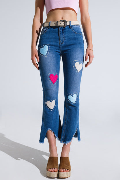 Q2 Vaqueros pitillo oscuros con corazones rodeados de tachuelas