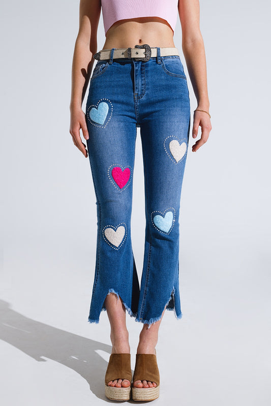 Q2 Vaqueros pitillo oscuros con corazones rodeados de tachuelas