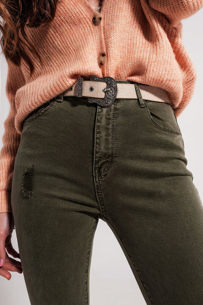Vaqueros pitillo verdes con diseño rasgado