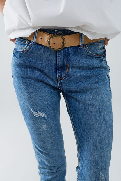 Vaqueros super ajustados en denim elástico con detalles desgastados