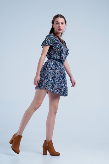 Vestido azul marino con estampado de flores y detalle abierto en la espalda