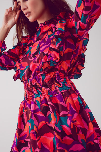 Vestido corto fucsia con estampado floral capas y volantes