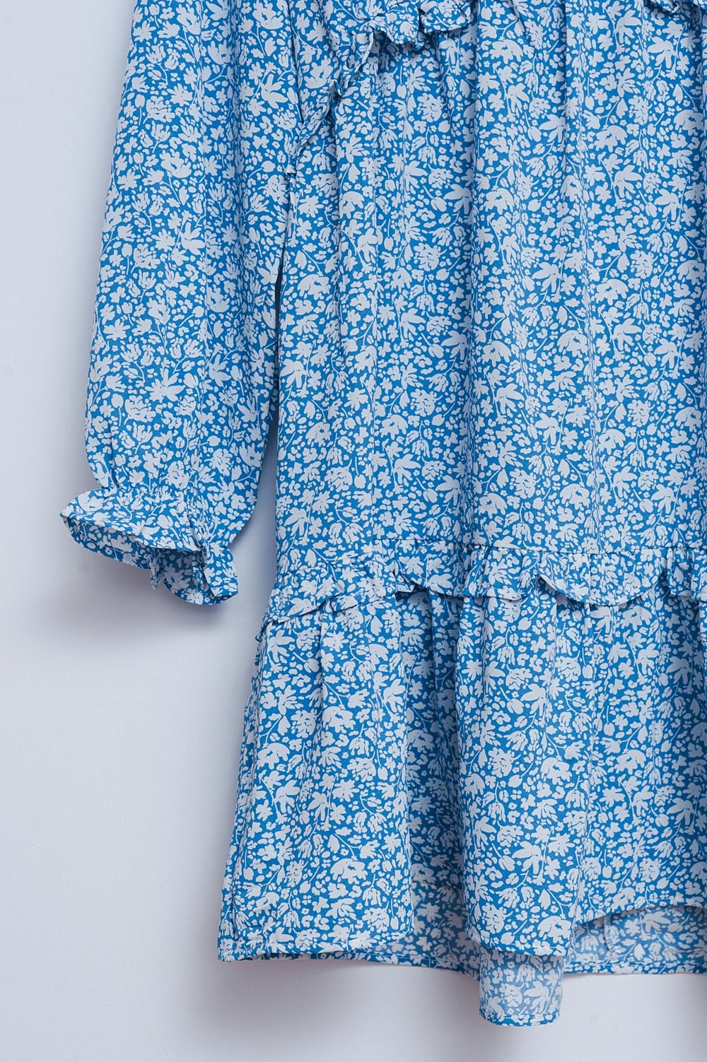 Vestido de tarde corto azul con espalda al aire y estampado de flores