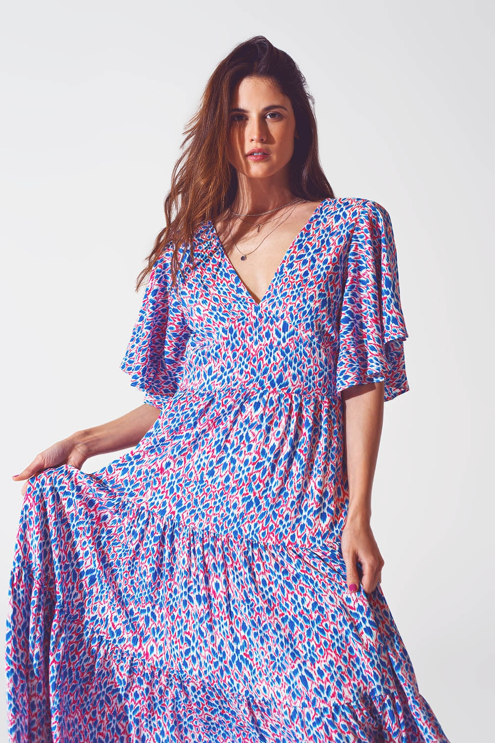 Vestido largo con espalda abierta y lazo en estampado morado