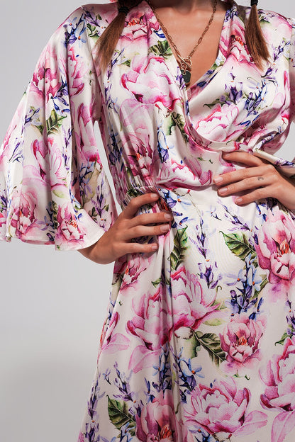 Vestido largo con estampado floral y mangas con vuelo rosa