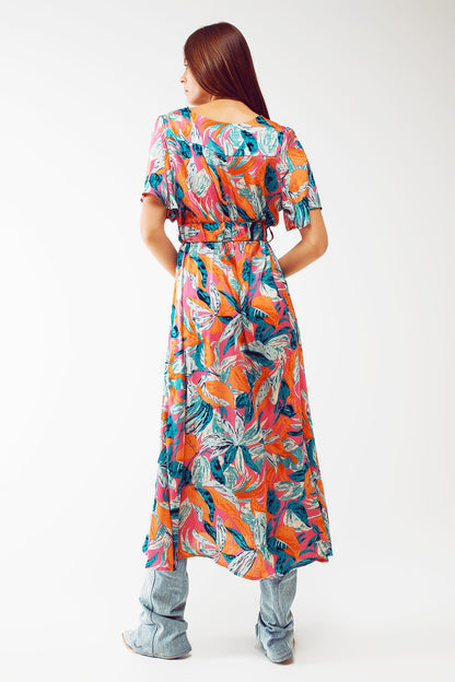 Vestido largo cruzado con estampado floral y cinturón en naranja