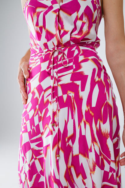 Vestido midi halter con cintura ceñida en estampado abstracto fuchsia y blanco