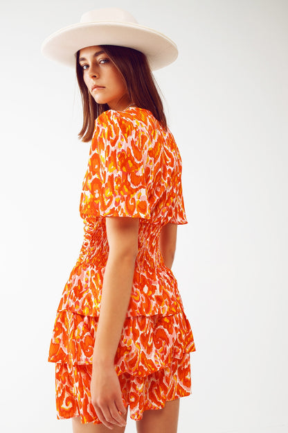 Vestido mini con escote en V y estampado floral en naranja