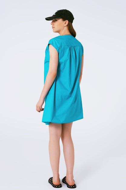 Vestido mini de popelina sin mangas en turquesa