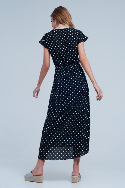 Vestido negro midi cruzado con estampado de mezcla de lunares
