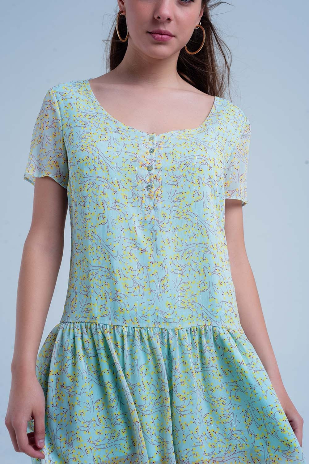 Vestido verde estampado con falda plisada
